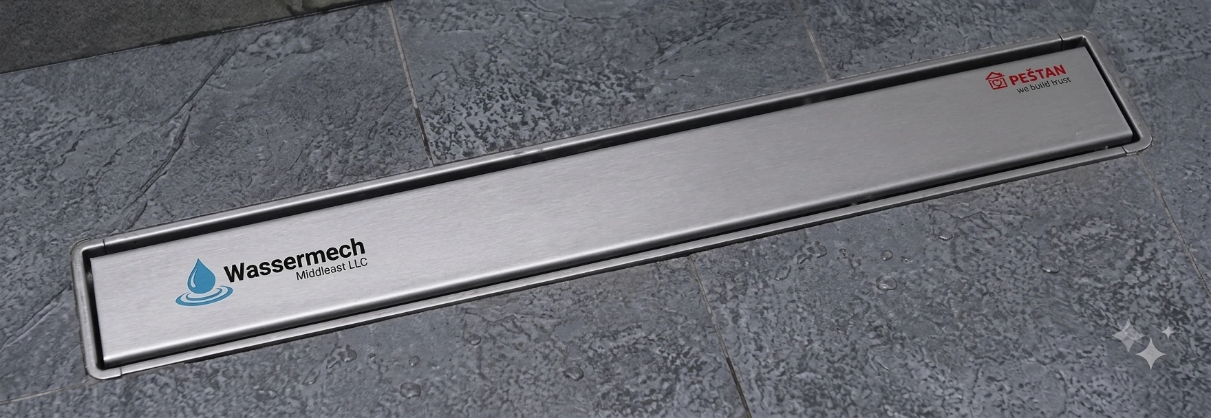 Confluo linear shower drain installed in a stone floor